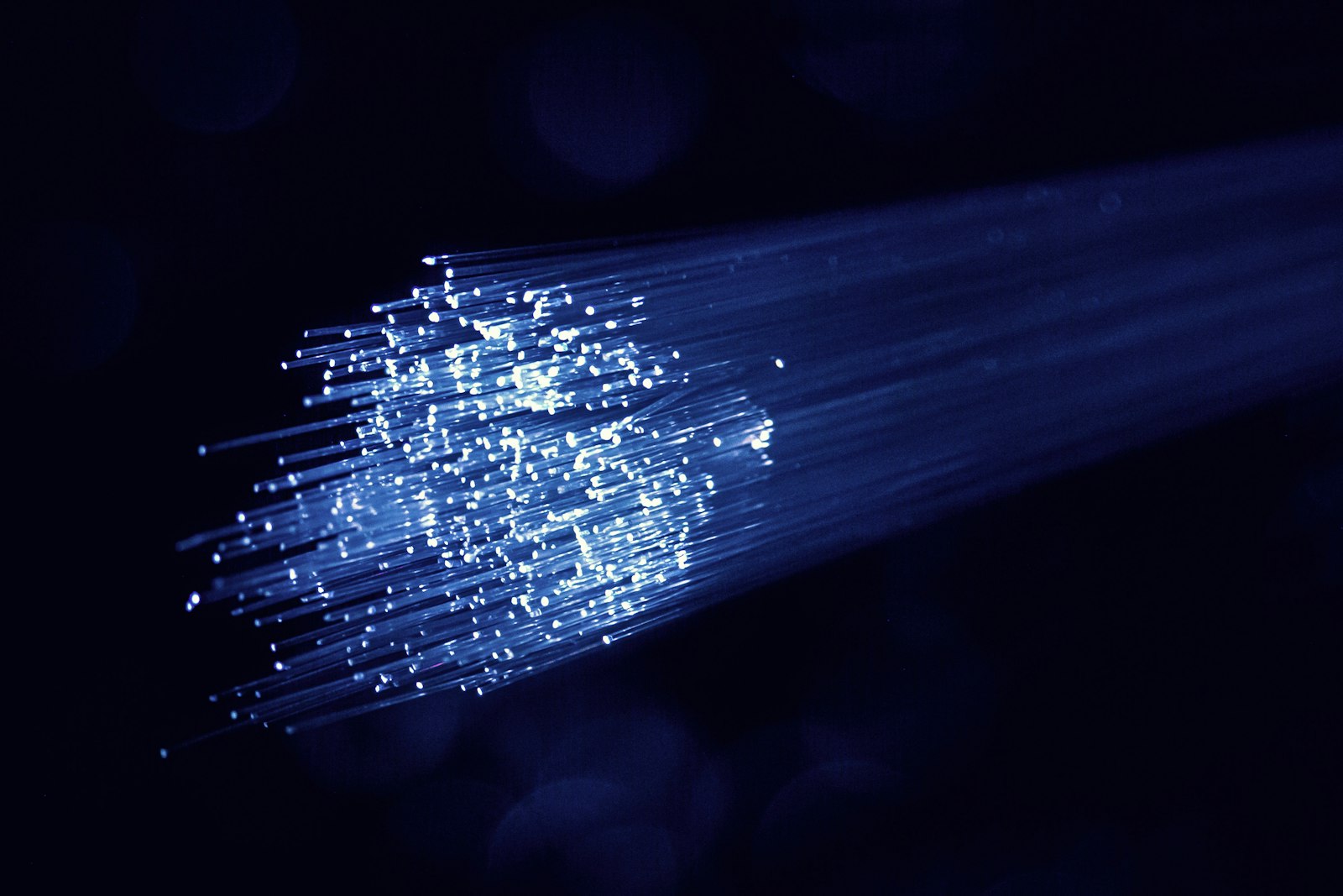 Light pulses traveling through fiber optic strands
