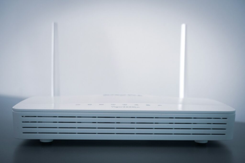 White WiFi router with status lights showing disconnect issue