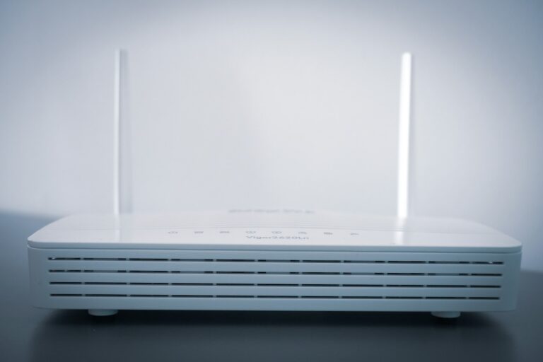 White WiFi router with status lights showing disconnect issue